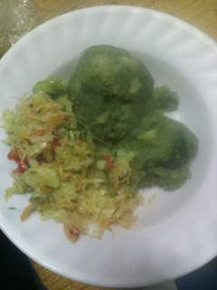 A picture of Mashed potatoes with greens.