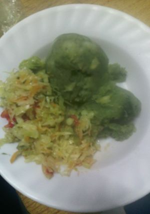 A picture of Mashed potatoes with greens.