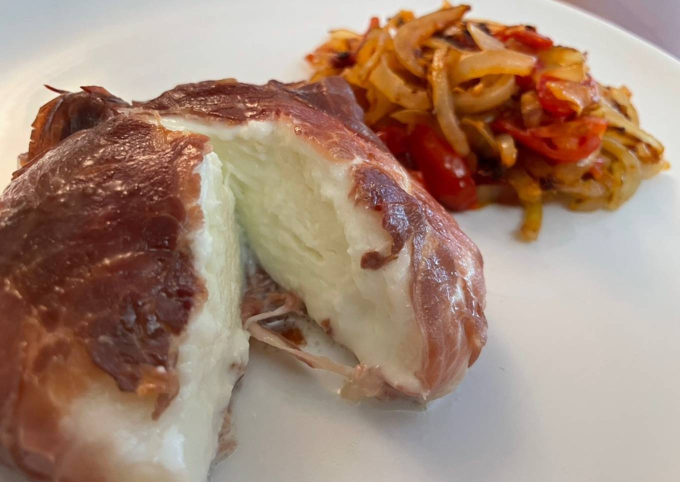 Simple Way to Prepare Quick Oven Baked Mozzarella wrapped in Parma Ham, with sautéed Onion and Tomato