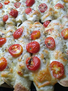 Una foto de Canelones de acelga con tomates cherry