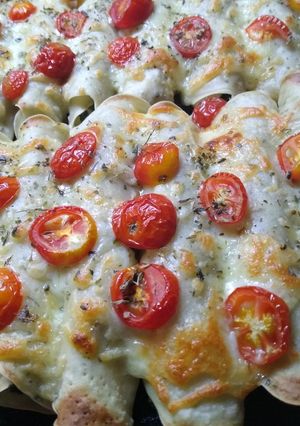 Una foto de Canelones de acelga con tomates cherry