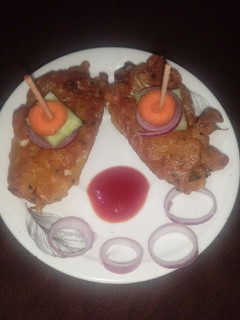 A picture of Cabbage wrap with stuffed noodles.