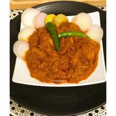 A picture of Achari Murgh/Chicken Curry.