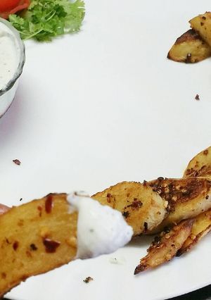 A picture of Baked potato wedges with homemade cream cheese.