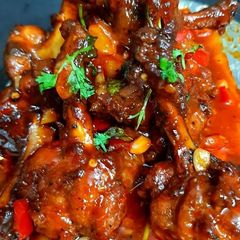 A picture of Chicken Lollipops in gravy.