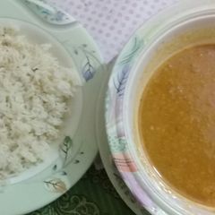 A picture of Moong dal with boiled rice.
