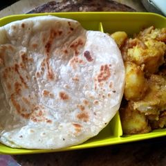 A picture of Lunch box paratha and milky dum aloo.