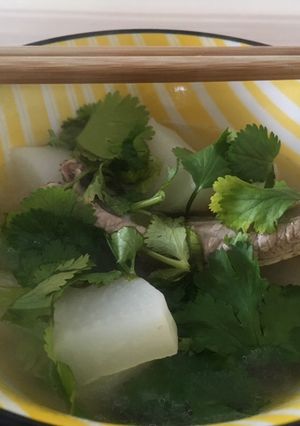 A picture of Pork rib radish soup with coriander 🌿.