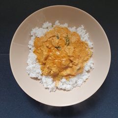 A picture of Butter Chicken Coriander and Rice.