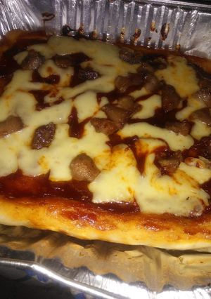 Una foto de Pizza de queso con chicharrón