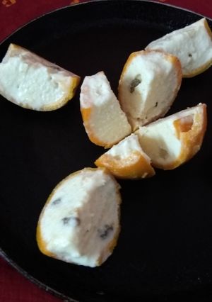 A picture of Orange wedges icecream.
