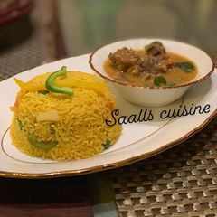 A picture of Turmeric rice and beef curry.
