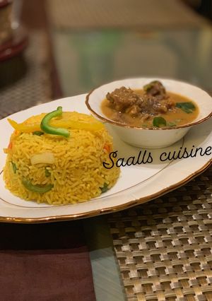 A picture of Turmeric rice and beef curry.
