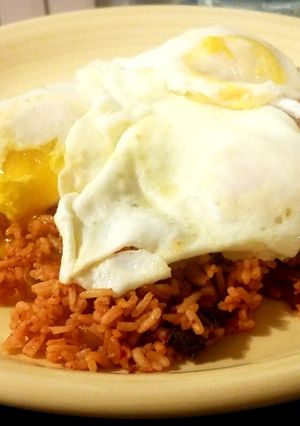 A picture of Kimchi Rice with Fried Eggs.