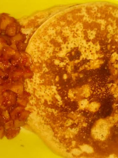 A picture of Pancakes with sauce.