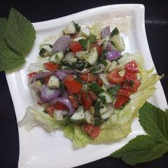 A picture of Italian rustic cucumber and tomato salad.