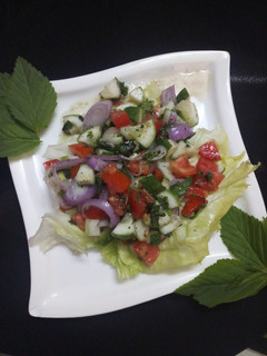 A picture of Italian rustic cucumber and tomato salad.