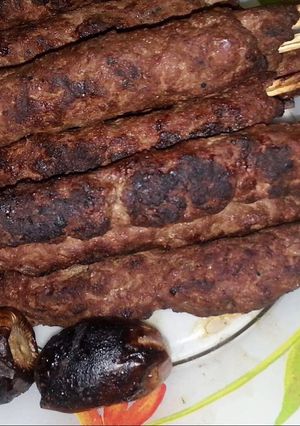 A picture of Grilled Kofta on Charcoal 🍖🍖🍖.