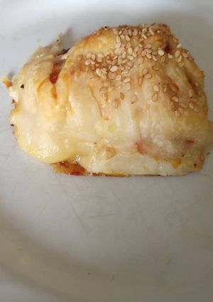 Una foto de Rollitos de pollo, berenjena, jamón y queso