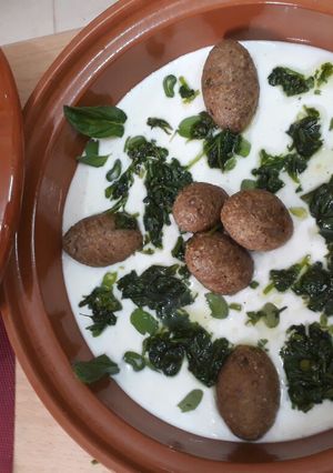 A picture of Fried Kibbeh with Yogurt Sauce.