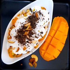 A picture of Creamy Mangoes with nuts🥭🥭🥭🥭🥭.