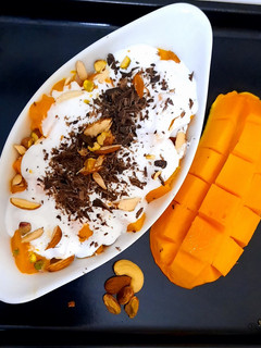 A picture of Creamy Mangoes with nuts🥭🥭🥭🥭🥭.