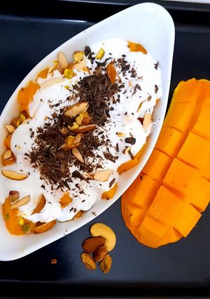 A picture of Creamy Mangoes with nuts🥭🥭🥭🥭🥭.