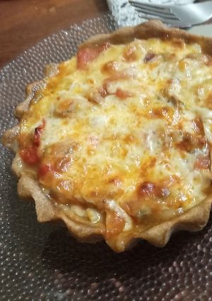 Una foto de Tarta integral de hongos, tomates, y mozzarella