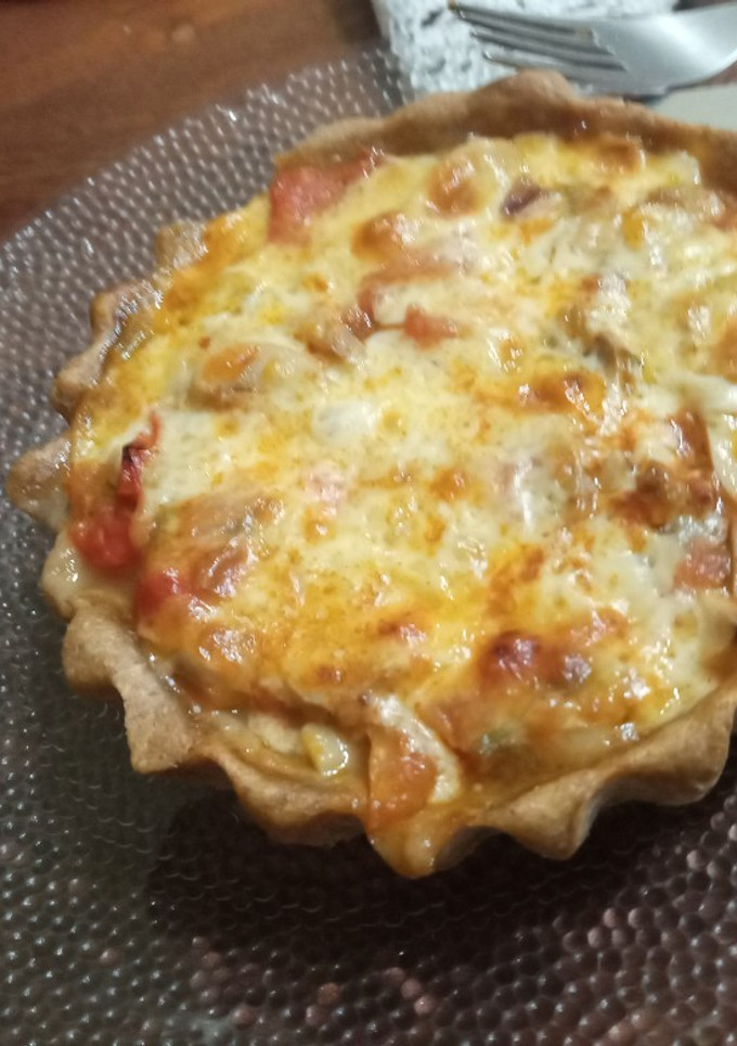 Una foto de Tarta integral de hongos, tomates, y mozzarella