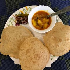 A picture of Aloo bhaji with poori.
