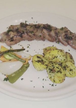 Una foto de Filete en salsa de champiñones