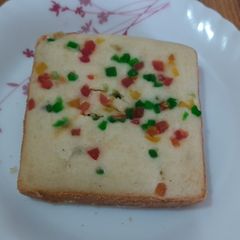 A picture of Eggless tutti frutti sponge cake.