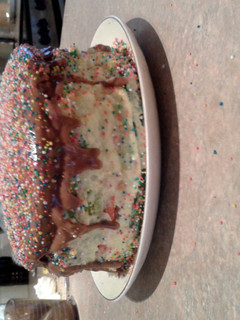A picture of Home Made (from a cake mix) Rainbow Cake.