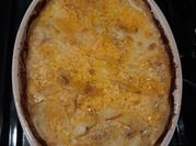 A picture of cheesy red potatoes
