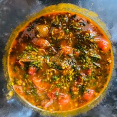 A picture of Baby tomato shaak (curry).
