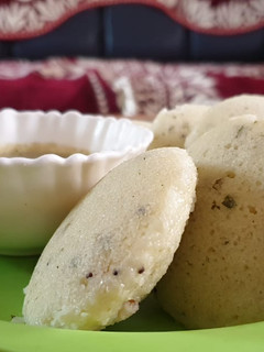 A picture of Quick rava idli with leftovar daal sambhar.