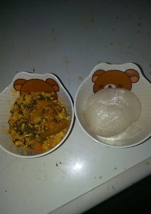 A picture of Egusi soup and akpu.