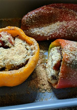 A picture of Stuffed peppers with spinach and soy ground meat.