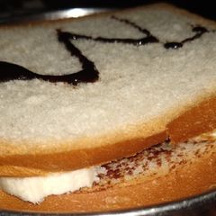 A picture of PBC peanut,banana, chocolate SANDWICH.