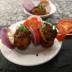 A picture of Dum Aalu in tamarind paste.