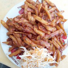 A picture of Homemade Chips Masala with Salad.