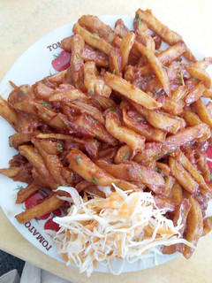A picture of Homemade Chips Masala with Salad.