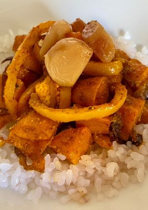 A picture of Roasted Sweet Potatoes with Spices, Yellow Peppers, and Oven-Roasted Garlic.