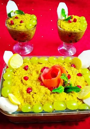 A picture of Moong daal khichdi with fruit and vegetables.