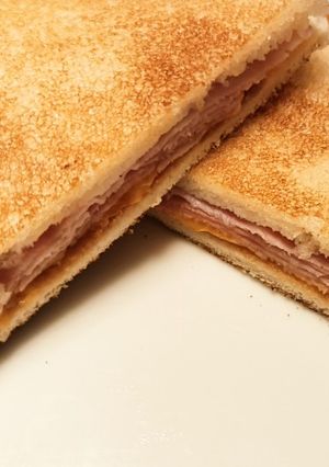 A picture of Ham, cheddar and HP brown sauce fried toastie.