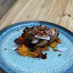 A picture of Pork Belly with sweet potato puree.