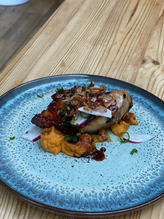 A picture of Pork Belly with sweet potato puree.