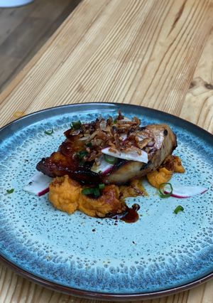 A picture of Pork Belly with sweet potato puree.