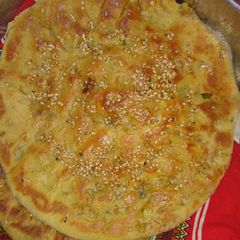 A picture of Aloo ka Naan khasta on tawa.