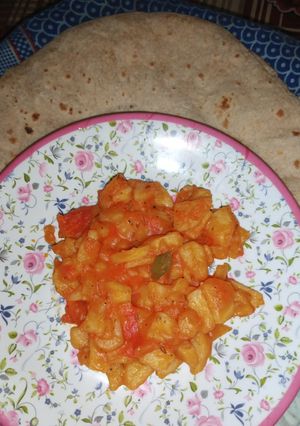 A picture of Potato Karahi with plain Roti.